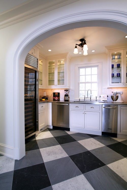 Here in marble gingham flooring set on the diagonal makes this kitchen bold and dynamic.  Tim Kriebel Design.