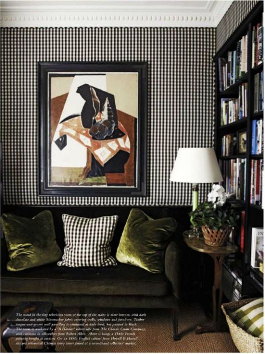 Here walls and decorative pillows are upholstered in the same gingham fabric.  Juxtaposing with lacquered black shelving, contemporary art and chic green velvet and the look becomes much more evolved